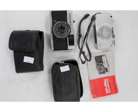 Three vintage cameras including an Olympus Trip 