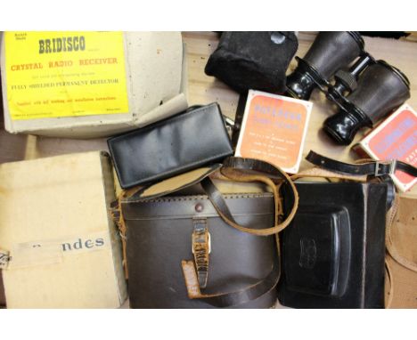 A collection of assorted vintage cameras and radio equipment