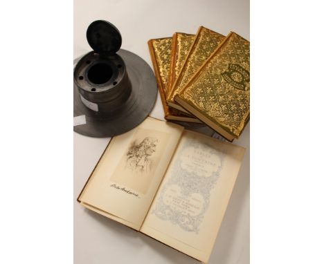 Early 20th century pewter inkwell along with five decorative books