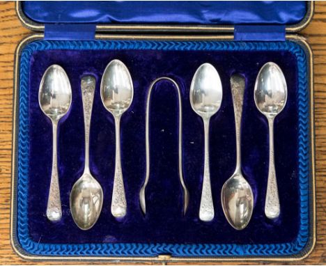 A boxed set of silver tea spoons and sugar tongs, Sheffield 1909 by maker Cooper Brothers & Sons