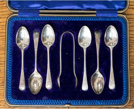 A boxed set of silver tea spoons and sugar tongs, Sheffield 1909 by maker Cooper Brothers & Sons