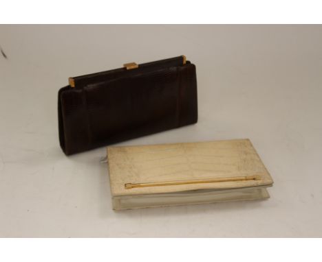 A vintage lizard skin clutch bag, with chain, bearing Harrods label to the inside; together with a vintage cream snake skin c