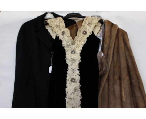 A black late 1940s velvet evening dress with 'V' neck front and back, with lace and bead and spangle embroidered decoration, 