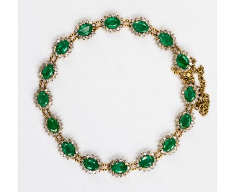 An emerald and diamond bracelet set in 18ct yellow gold comprising of sixteen cluster details with emerald centre surrounded 