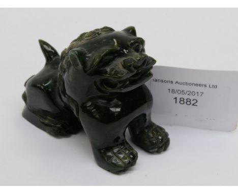 A dark green jade Lion 