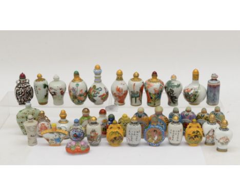 Thirty five assorted Chinese ceramic and glass decorative snuff bottles, mainly modern types