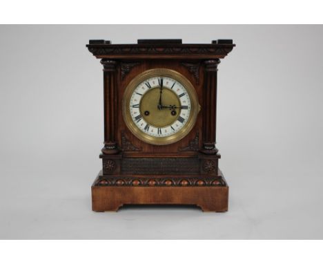 A mahogany 8 day mantle clock, early 20th Century with white enamel chapter ring dial 
