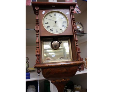 A.R. Moretti of Cardiff wall alarm clock in mahogany and inlaid case, having a mirror back, partial restoration, requires fur