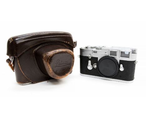 Leica: A Leica M3-1 000 460 DBP camera within brown leather cased, no lense, marked 'Ernst Leitz GMBH, Wetzlar, Germany'.