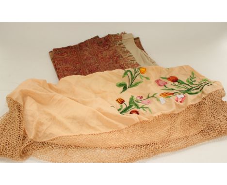 A 1860/70 paisley shawl, the centre panel has been repaired and a silk crepe piano shawl heavily hand embroidered a wide croc