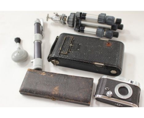 A small assortment of cameras and equipment to include a Robot, Germany camera, a Kodak Autographic Junior camera and others 