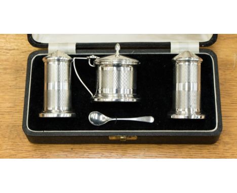 A George VI Art Deco silver cruet set, Birmingham 1937, makers mark 'Joseph Gloster Ltd', comprising mustard pot, mustard spo