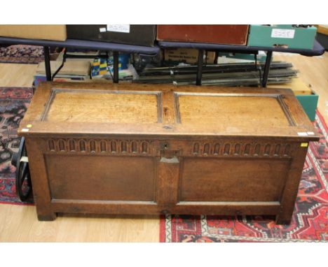 A mid 17th Century oak transitional chest, the boarded construction to sides and frame and panel construction to front