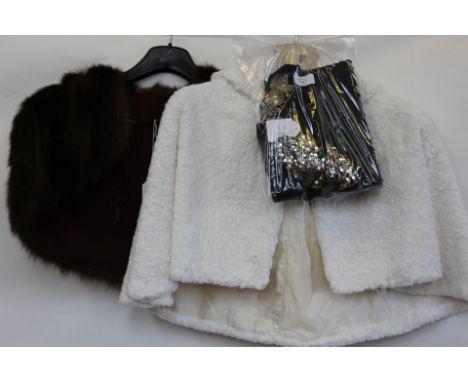 A late 1940s small cape in brown fur; together with a white cotton faux fur cape - 1950s; together with a 1920s gold sequinne