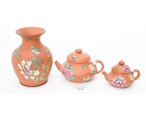 A small Wedgwood Rosso Antico vase and two teapots and covers, decorated with polychrome enamel flowers, 19th Century, vase i