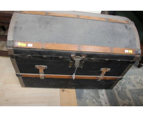 A 19th Century wood and steel bound travelling trunk, with a sectioned interior