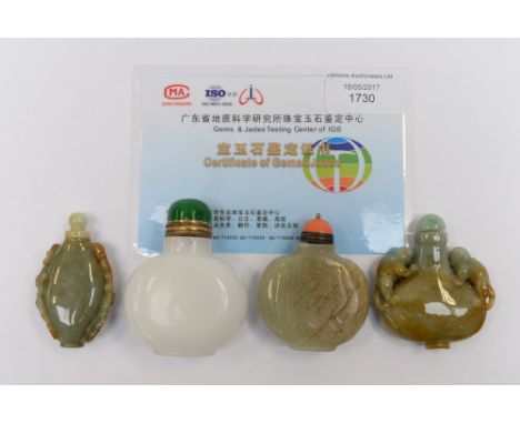 A Chinese white jadeite snuff bottle, 20th century, of flattened shouldered form, plain 7cms, and three jade snuff bottles of