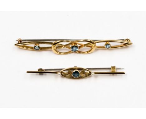 A 18ct stamped blue stone possibly aquamarine bar brooch art nouveau style, approx length 6.8cm, along with a 15ct bar brooch