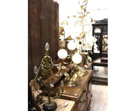 A pair of floor standing gilt metal leaf design lamps with round white shades and matching table lamp and a ceiling lamp, tog