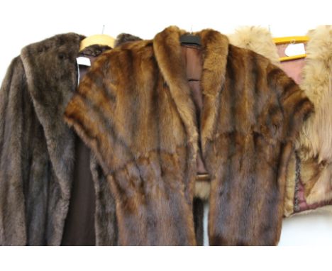 A dark brown Mu squat fur coat - 1950, and a ginger Fox cape, and a striped Musquash cape (3)