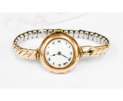 A ladies 9ct gold cased Rolex circa 1918 with 15 jewels, enamel dial and Roman Numerals in velvet bag