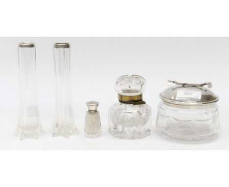 A pair of silver collared glass stem vases, London 1927, with a cut glass inkwell and cover, a silver topped cut glass smelli