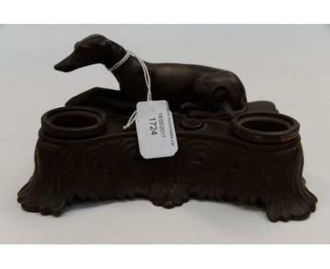 A terracotta inkwell with a laid down Greyhound on top, impressed S and Co to base (1) 