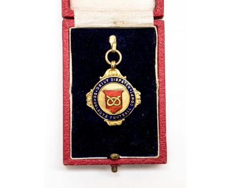 Football Medal: A boxed 9ct gold 'Daily Dispatch Schoolboys Football Compt.' medal with a blue and red enamel front, back uni