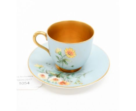 A Royal Worcester cup and saucer duck egg blue ground with interior gilding, decorated with floral sprays, signed W. Hale, ea