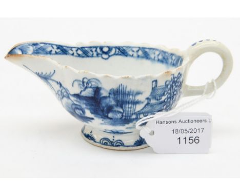 A bow blue and white sauce boat 'Desirable Residence Pattern', circa 1760, 5 cm high, 13 cm long including handle approx 