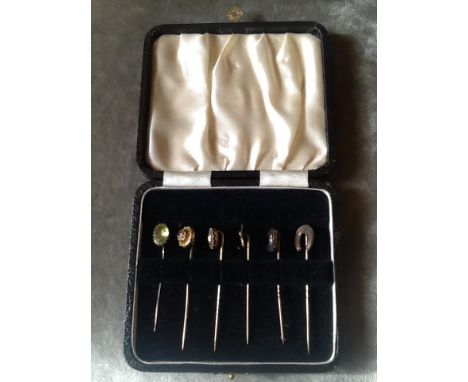 6 Boxed, Victorian, 9 carat gold stick pins. Various settings to&nbsp;terminals, 1 Ruby, 1 seed pearl, 4 X paste and gold. A 