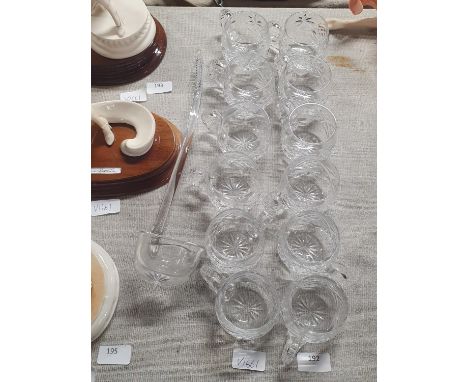 Twelve cut glass hot toddy glasses and glass ladle, shipping unavailable