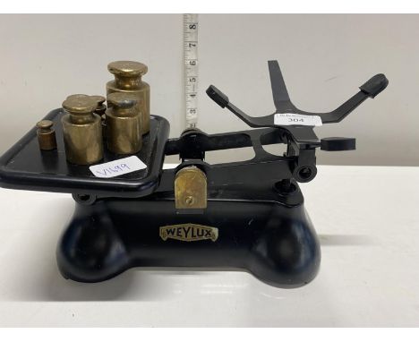 A vintage set of weighluxe scales with brass weights, shipping unavailable