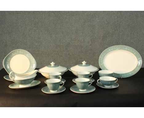 A Royal Doulton 'Cascade' pattern part four person tea and dinner service. Includes, gravy boat, two tureens, four cups and s