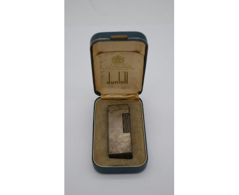 A vintage Dunhill lighter, marked to base and in original case. H.3 W.5 D.9cm (boxed) 