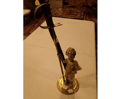 Brass poker housed in a stand representing a highland soldier and a rootwood walking stick possibly blackthorn