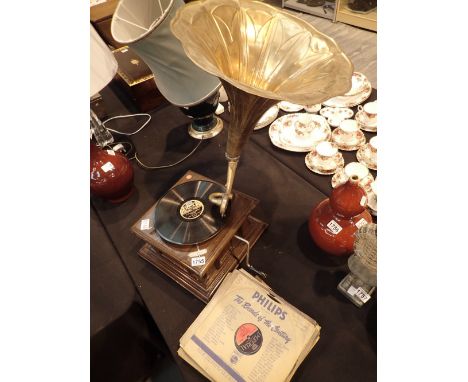 Vintage gramophone and a selection of 78s CONDITION REPORT: This item is working at lotting.We believe this is probably a rep