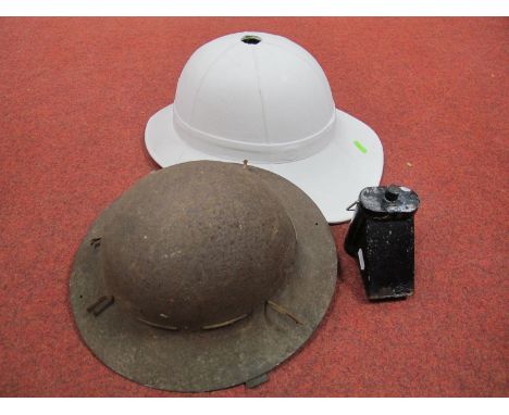 Royal Marines White Helmet, post WWII, no badge; a WWII Fire Watchers steel helmet, rusty and a WWII cycle/signalling lamp, r