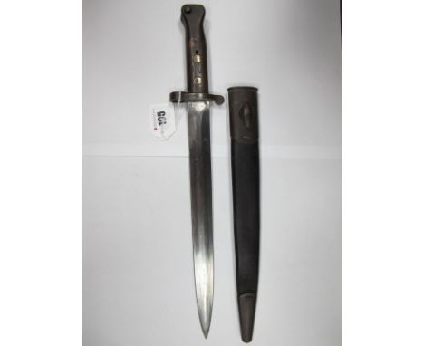 A Victorian Lee Metford Bayonet, dated 1892, by Wilkinson, double edged blade with W.D. mark, in black leather scabbard, with