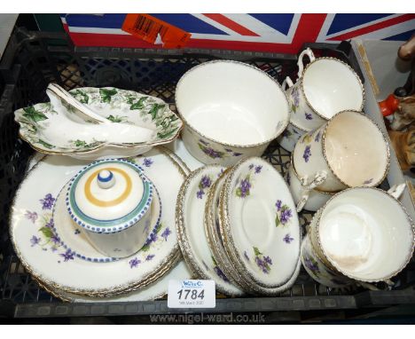 A quantity of china tea set including cake plate, six plates, (one damaged), six cups and saucers (cups badly marked), Africa