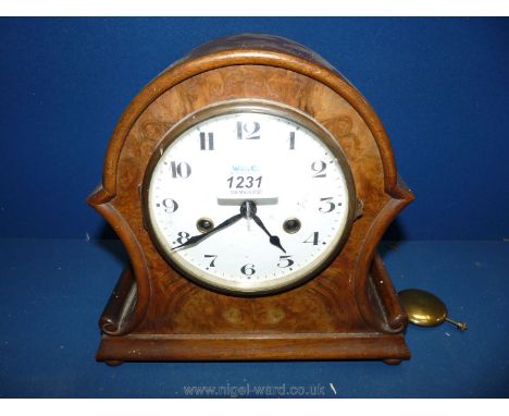 A walnut veneered Hamburg American mantle Clock.