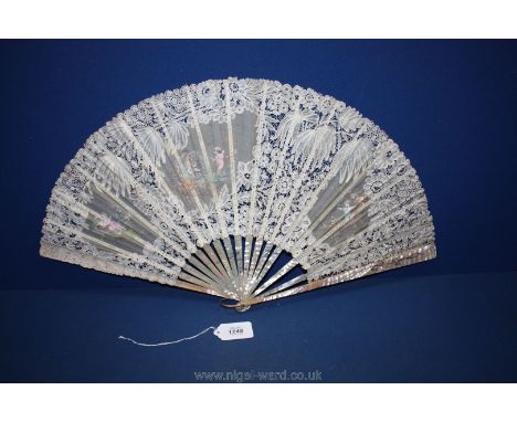 A late 19th c. Fan, mother of pearl sticks, Brussels bobbin lace, with painted panels of 'Bambini', approx. 35 cm.