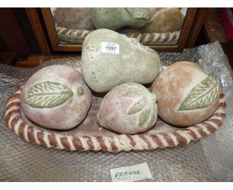 An extra large dish of ceramic fruit.