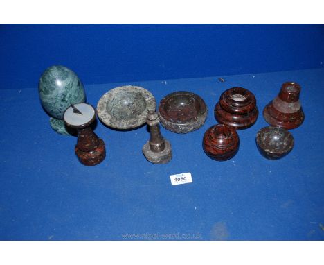 A quantity of Cornish Serpentine items including match strikers, dishes and sundial and an Italian marble doorstop in the sha