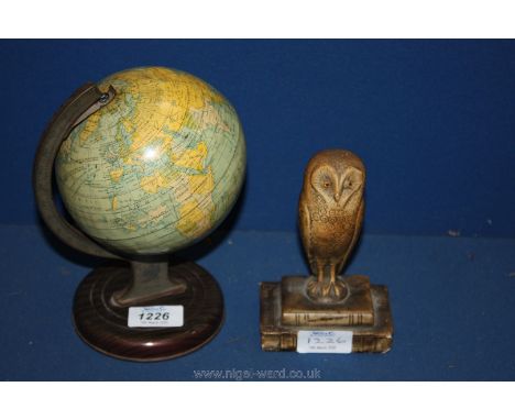 A Chad valley tin plate toy globe and a vintage plaster owl paperweight.
