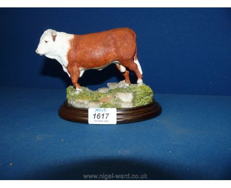 A Country Artists model of a horned Hereford Bull on a plinth; no: 01120, hand made in Stratford-Upon-Avon.