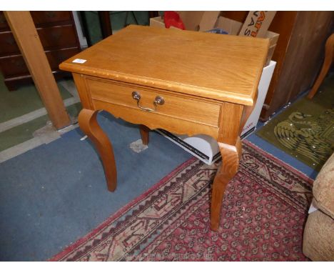 A pair of contemporary light Oak Side Tables standing on cabriole legs and each having a frieze drawer, 22 3/4'' wide x 16 7/