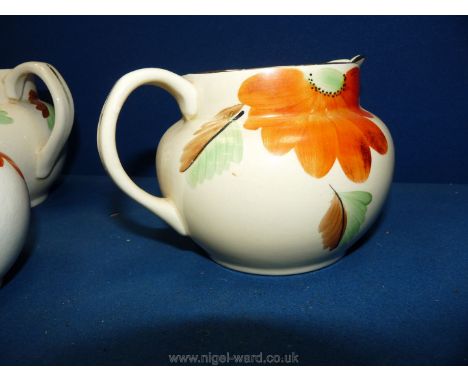 Three vintage Arthur Wood Jugs, cream ground with floral decoration (two a/f).