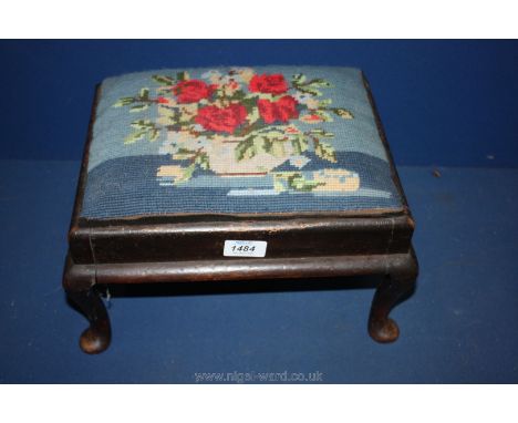 A low cabriole legged dark Mahogany framed Footstool having drop-in upholstered top decorated with a tapestry illustration of