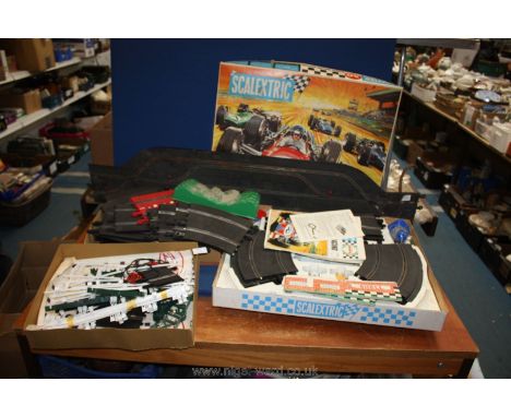 A Scalectric set, boxed 'Grand Prix 50' and a box of Scalextric additional track, markers etc.